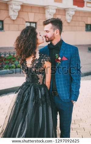 Happy gothic couple in halloween clothes. Vampire in renaissance dress. Gothic costume for halloween. Newlyweds couple on dark. Happy girl in renaissance clothing. Newlyweds feel temptation