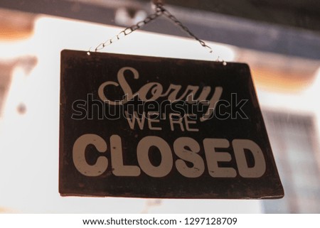 "Sorry we're closed" on signboard in Retro Style. Metal sign. 