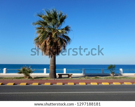 waterfront road and promenade on the beach with skyline and horizon of paola city cosenza calabria italy Royalty-Free Stock Photo #1297188181