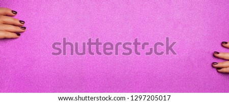 Female hands holding blank shimmer violet paper background. Make up artist, beauty concept. Beauty salon advertising banner with copy space for your information.