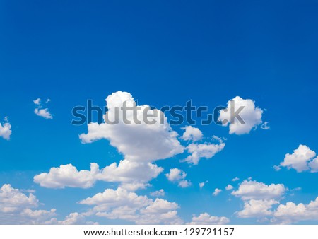 Blue sky and lots small clouds pattern Royalty-Free Stock Photo #129721157