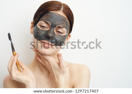 clear skin woman in a cosmetic mask of clay