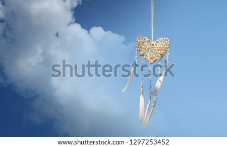 Dream catcher native american in the wind and blurred bright light background, love hope and dream concept