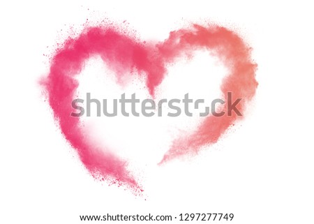 Valentine heart symbol. Red and pink  powder explosion on white background.