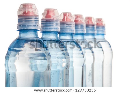 Plastic bottle of drinking water isolated on white