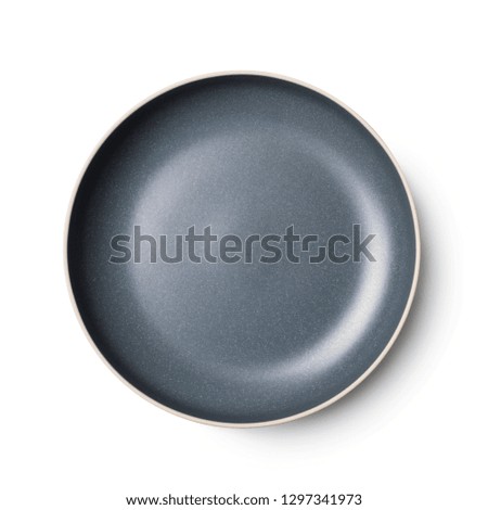 Empty ceramic round plate isolated on white with clipping path and shadow.View from above.