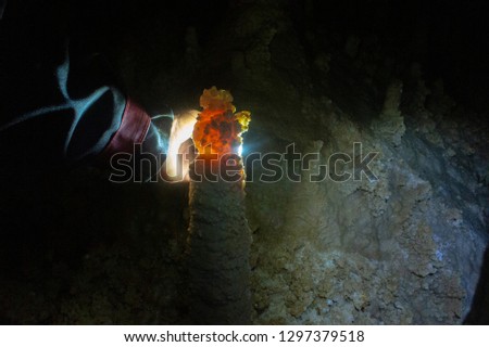 illuminated stalactites in isichenko caves, mezmay, russia