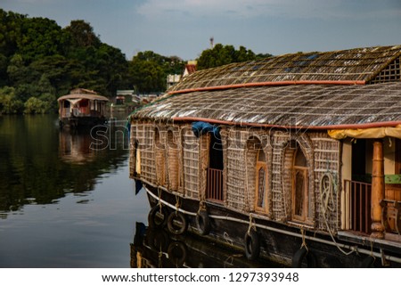Alappusha, also known as Allepey. Famous for it's backwaters and (house)boats. Pictures with nice and clear reflection in the water.  