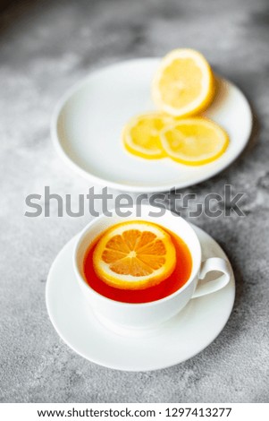 Tea, lemon, hot, drink. Tasty fragrant hot tea with a lemon on a concrete background