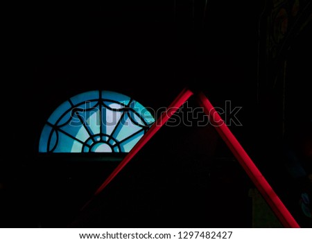 Abstract with semi circular patterned shape and red inverted V-shape
