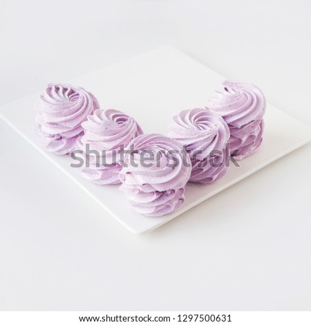 Merengue Marshmallow Zephyr on a plate, white background . Flat lay. Top view.  Berry sweet homemade zephyr or marshmallow. Traditional russian white homemade zephyr. Space for text. Copy Space. 