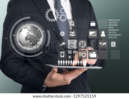 Businessman and internet and virtual reality concept - businessman pressing button on virtual screens