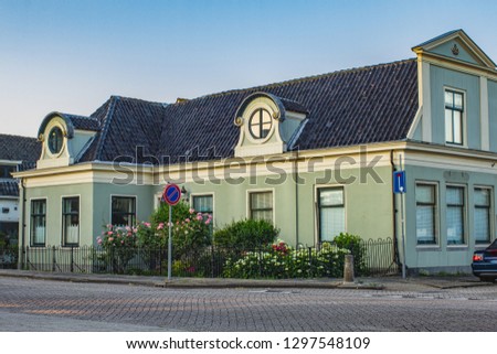 Photo of picturesque ethnographic Zaandam city,  Netherlands, Dutch house in pastel green color