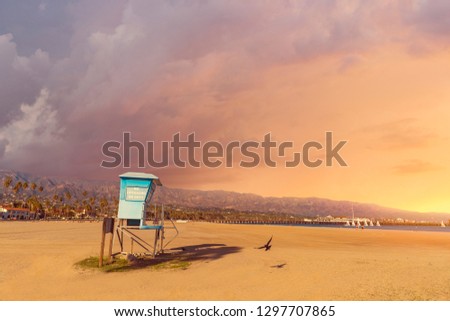 Empty beach and a lifeguard station at a beach in California in a stormy weather. Corona virus covid-19 lockdown time. No people