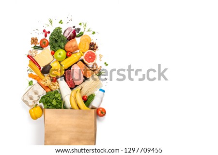 Grocery shopping concept - meat, fish, fruits and vegetables with shopping bag, top view Royalty-Free Stock Photo #1297709455