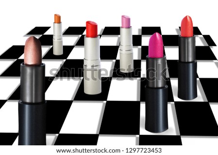 Colorful lipstick on a abstract chessboard.