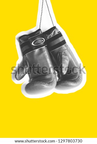 Boxing gloves image black and white on a yellow background. The concept of sports and martial arts. , Collage Magazine.