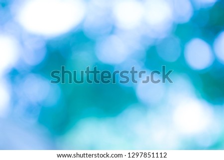 Blue blurred backdrop of nature, circle light wallpaper, white bokeh background