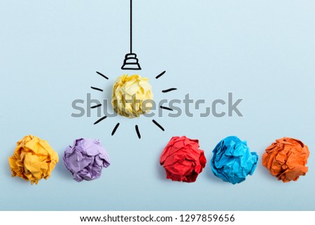 Inspiration concept crumpled paper light bulb metaphor for good idea.