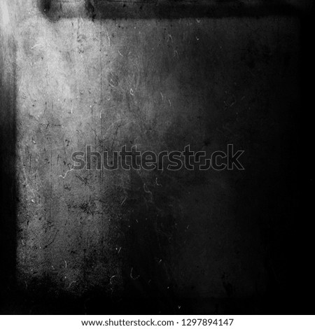 Dark grunge scratched scary horror background with black frame, dusty texture, space for your text or picture