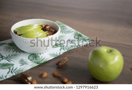 Green apple in a good morning in a white bowl