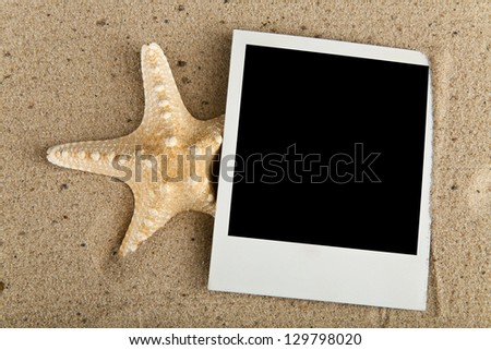 starfish and picture on sand