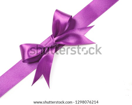 Purple satin ribbon bow cut out isolated on white background