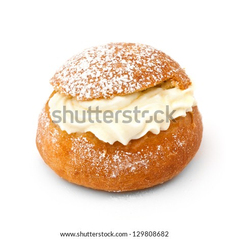 Close-up of traditional Swedish shrove bun (Semla) isolated on white background.