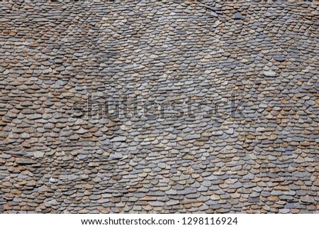 Slate pieces on a rooftop. Stone grunge textured background. Copyspace