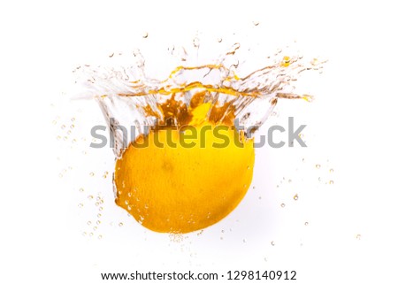 Whole lemon is thrown into the water and submerged.