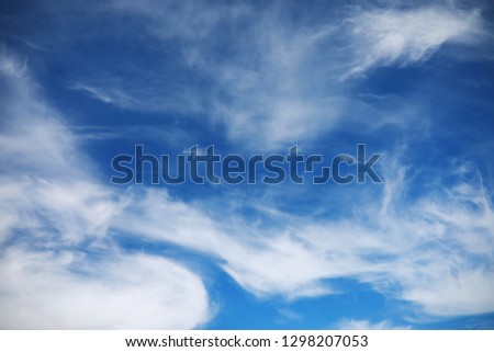 white clouds in the blue sky at noon summer
