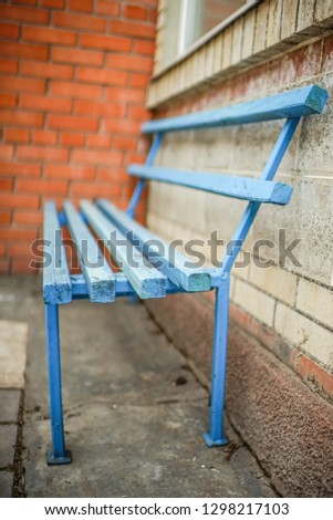 Old blue wooden bench in the yard