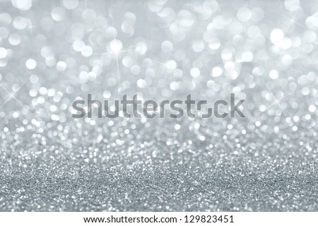 Shiny silver defocused glitter background with copy space