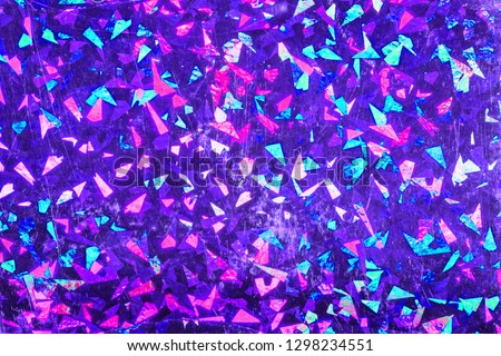 Aged blue foil with holographic effect. Holiday background. Holographic foil background. Confetti in air pattern. Royalty-Free Stock Photo #1298234551