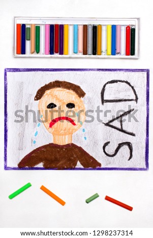 Colorful drawing: Crying sad man and word SAD