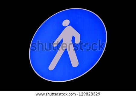 Pedestrian walking lane walkway footpath road sign on pole post, large blue round isolated route traffic roadside signage