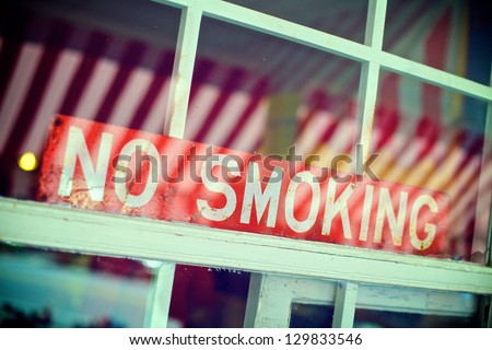No Smoking Sign in the Window of a Restaurant