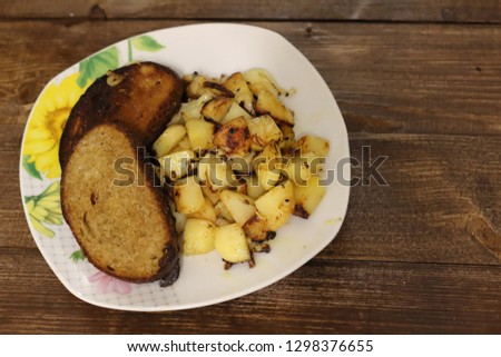 nutritious and tasty side dish with fried potatoes and bacon with bacon.
