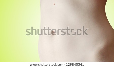 Dieting concept, Beautiful belly on green background