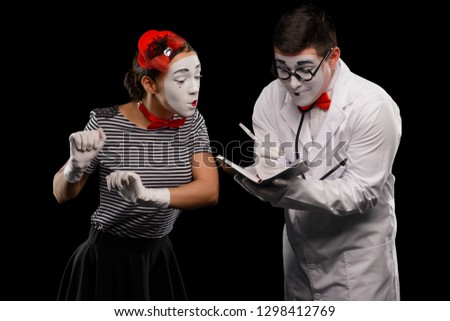 Doctor writing diagnosis and prescription, while his curious female patient looking. Pantomime, medical service, healthcare.