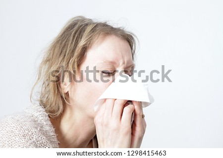 woman blowing her nose with white background stock image and stock photo