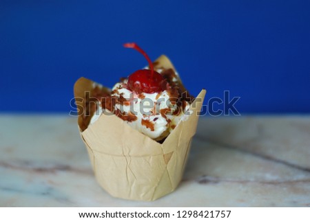 black forest cake on mable table and blue wall background