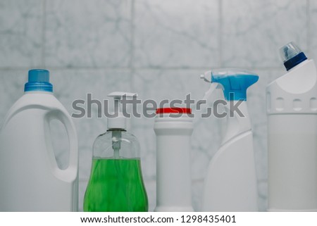 detergent bottles and chemical cleaning supplies in the bathroom