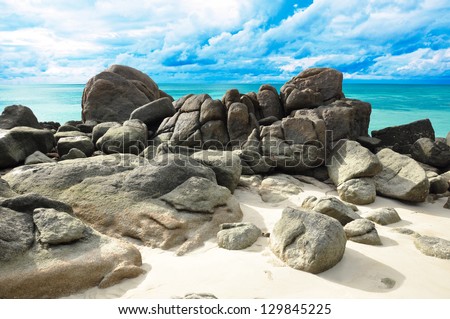 Rocks , sea and blue sky - Lipe island Thailand Royalty-Free Stock Photo #129845225