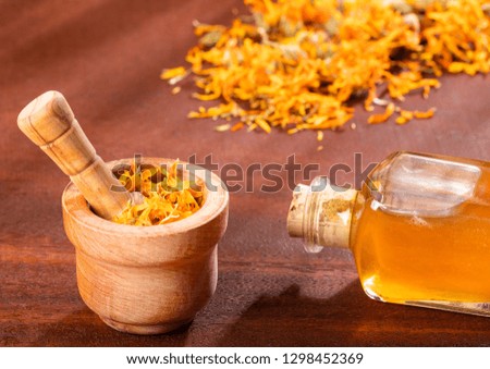 Aromatherapy essential oil with marigold flowers - Calendula officinalis