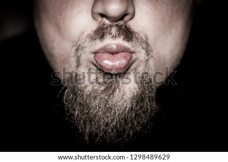 Bearded man kissing