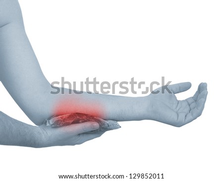 Holding ice gel pack on elbow. Medical concept photo. Isolation on a white background. Color Enhanced skin with red spot indicating location of the pain.