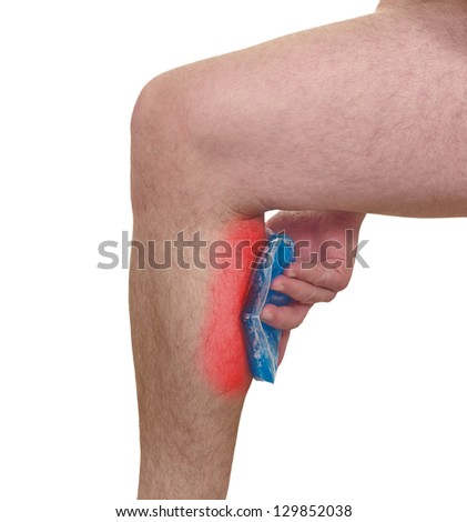 Cool gel pack on a swollen hurting calf. Medical concept photo. Isolation on a white background. Color Enhanced skin with red spot indicating location of the pain.