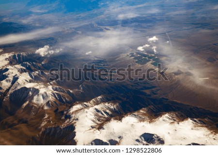 California mountains covered with Snow aerial View from airplane