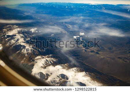 California mountains covered with Snow aerial View from airplane